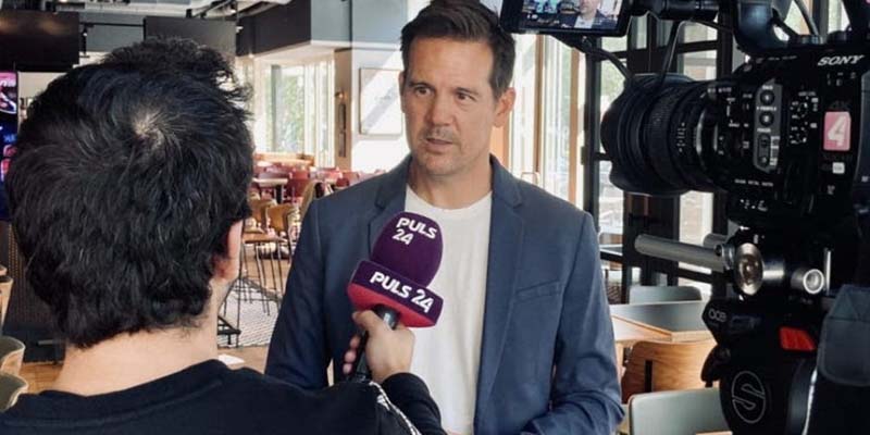 Former Willamette football player Chris Calaycay is interviewed for television. (Photo from Vienna Vikings football)