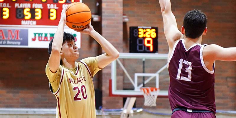 Ryder Hsiung prepares to release a 3-point shot over a defender.